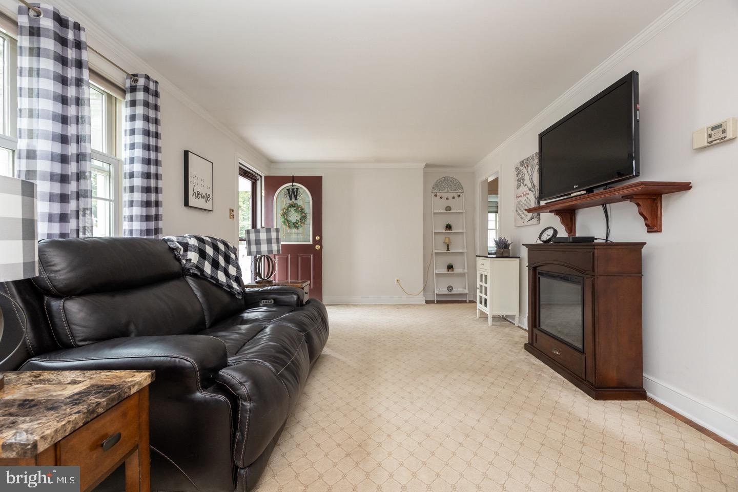 4221 Blair Mill Road Hatboro, PA 19040 - Photo 10 of 42 a living room with furniture and a flat screen tv