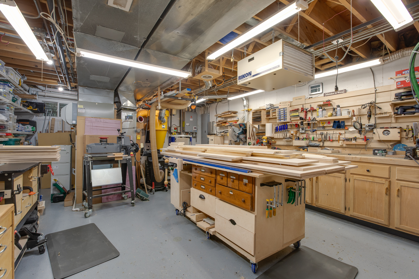 828 Sanctuary Lane Naperville, IL 60540 - Photo 23 of 28 a utility room with lots of wooden furniture and cabinets