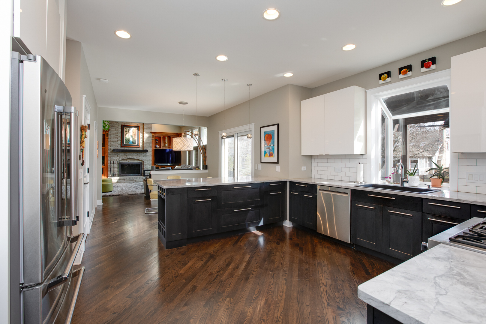 828 Sanctuary Lane Naperville, IL 60540 - Photo 5 of 28 a kitchen with wooden floors and wooden cabinets