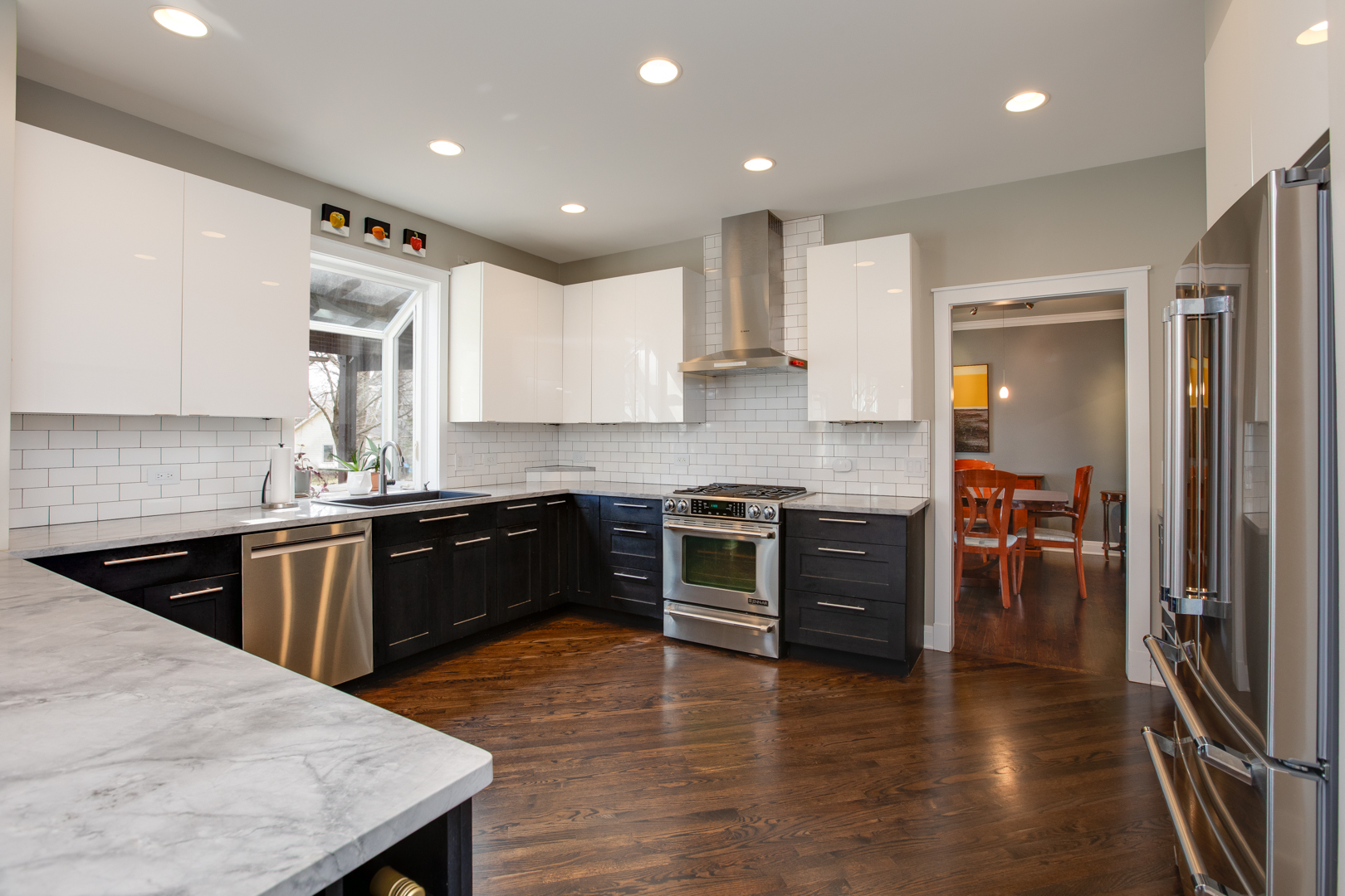 828 Sanctuary Lane Naperville, IL 60540 - Photo 7 of 28 a large kitchen with stainless steel appliances granite countertop a stove a sink and a refrigerator