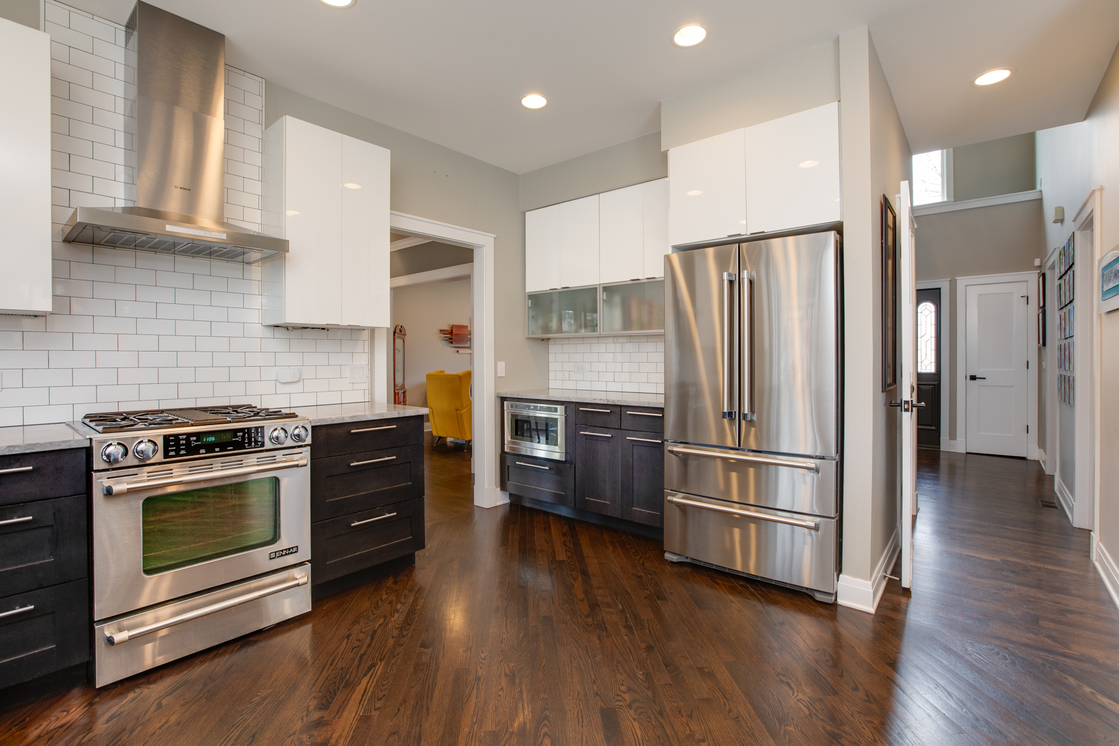 828 Sanctuary Lane Naperville, IL 60540 - Photo 8 of 28 a kitchen with a refrigerator stove and wooden floor