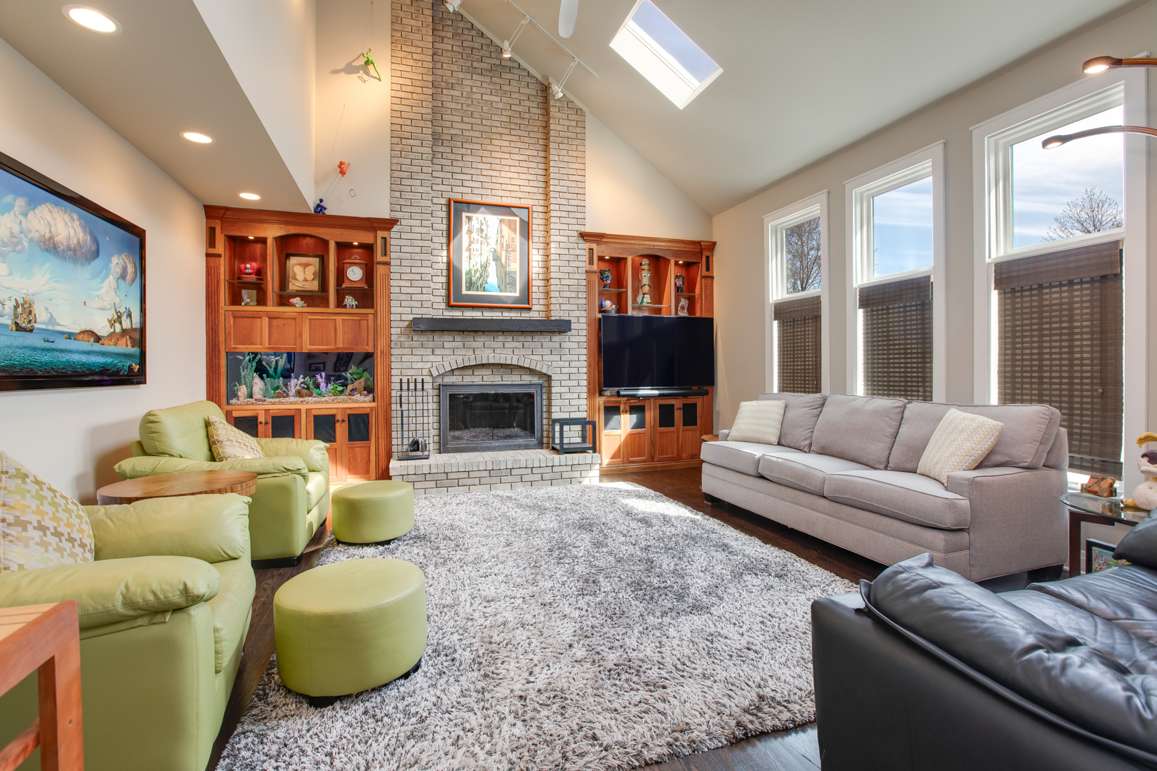 828 Sanctuary Lane Naperville, IL 60540 - Photo 9 of 28 a living room with furniture a fireplace and a flat screen tv