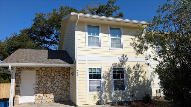 front view of a house with a small yard
