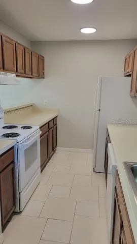 a kitchen with a stove and a microwave