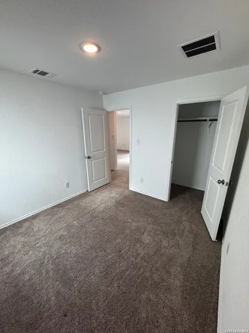 an empty room with a fireplace