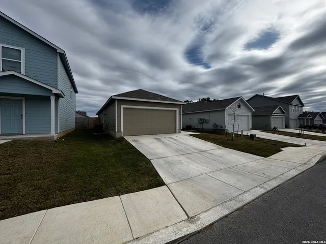 a house view with a garden space