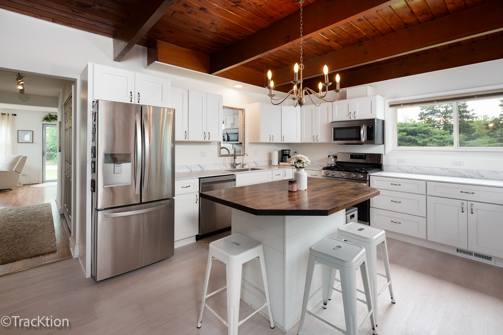 10S450 Ruth Drive Lemont, IL 60439 - Photo 6 of 22 a kitchen with kitchen island granite countertop a sink appliances cabinets and furniture