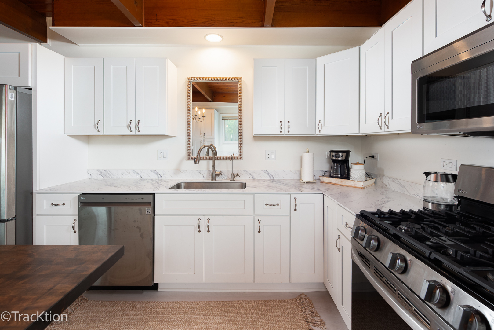 10S450 Ruth Drive Lemont, IL 60439 - Photo 8 of 22 a kitchen with stainless steel appliances a sink dishwasher stove and white cabinets