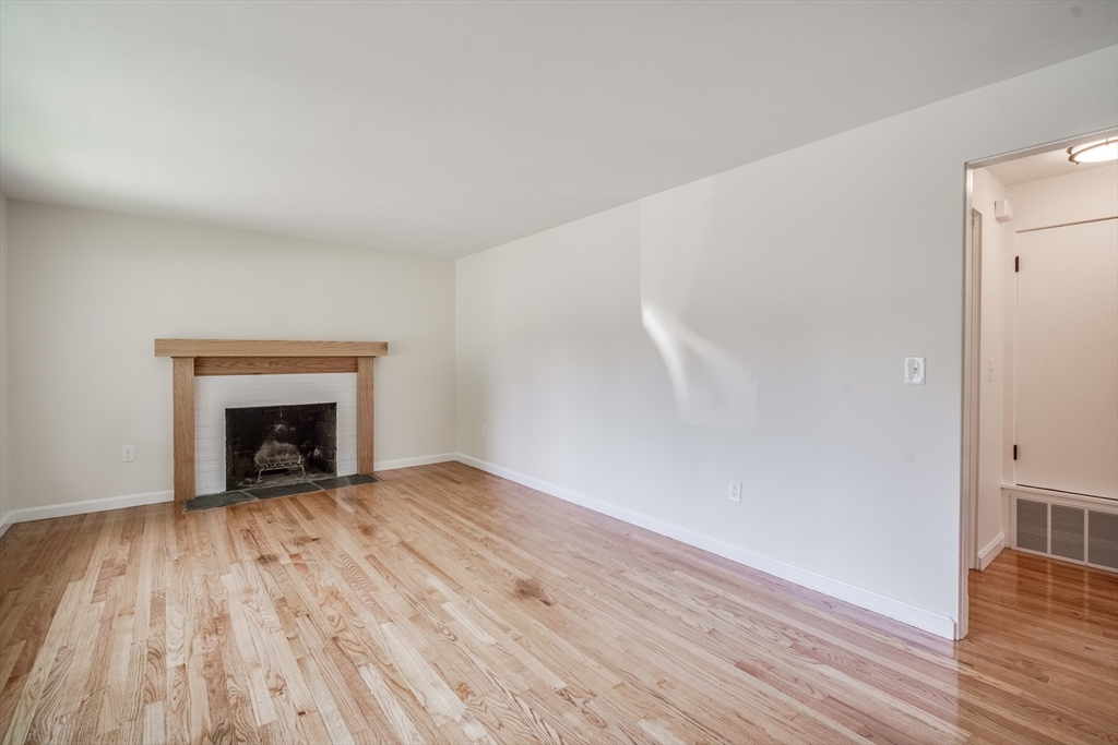 56 Audley Road Springfield, MA 01118 - Photo 11 of 37 a view of an empty room and wooden floor