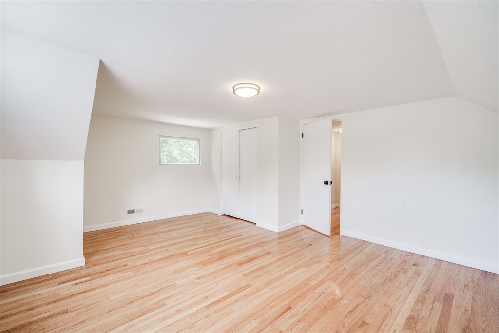 56 Audley Road Springfield, MA 01118 - Photo 21 of 37 a view of empty room with wooden floor