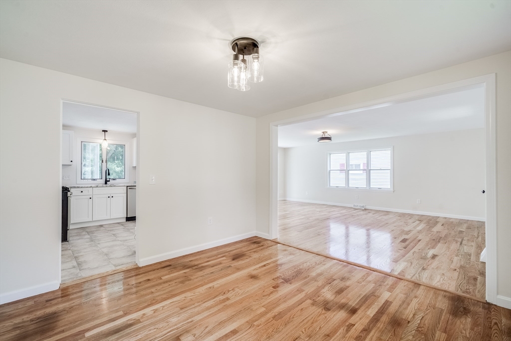 56 Audley Road Springfield, MA 01118 - Photo 8 of 37 a view of empty room with wooden floor and window