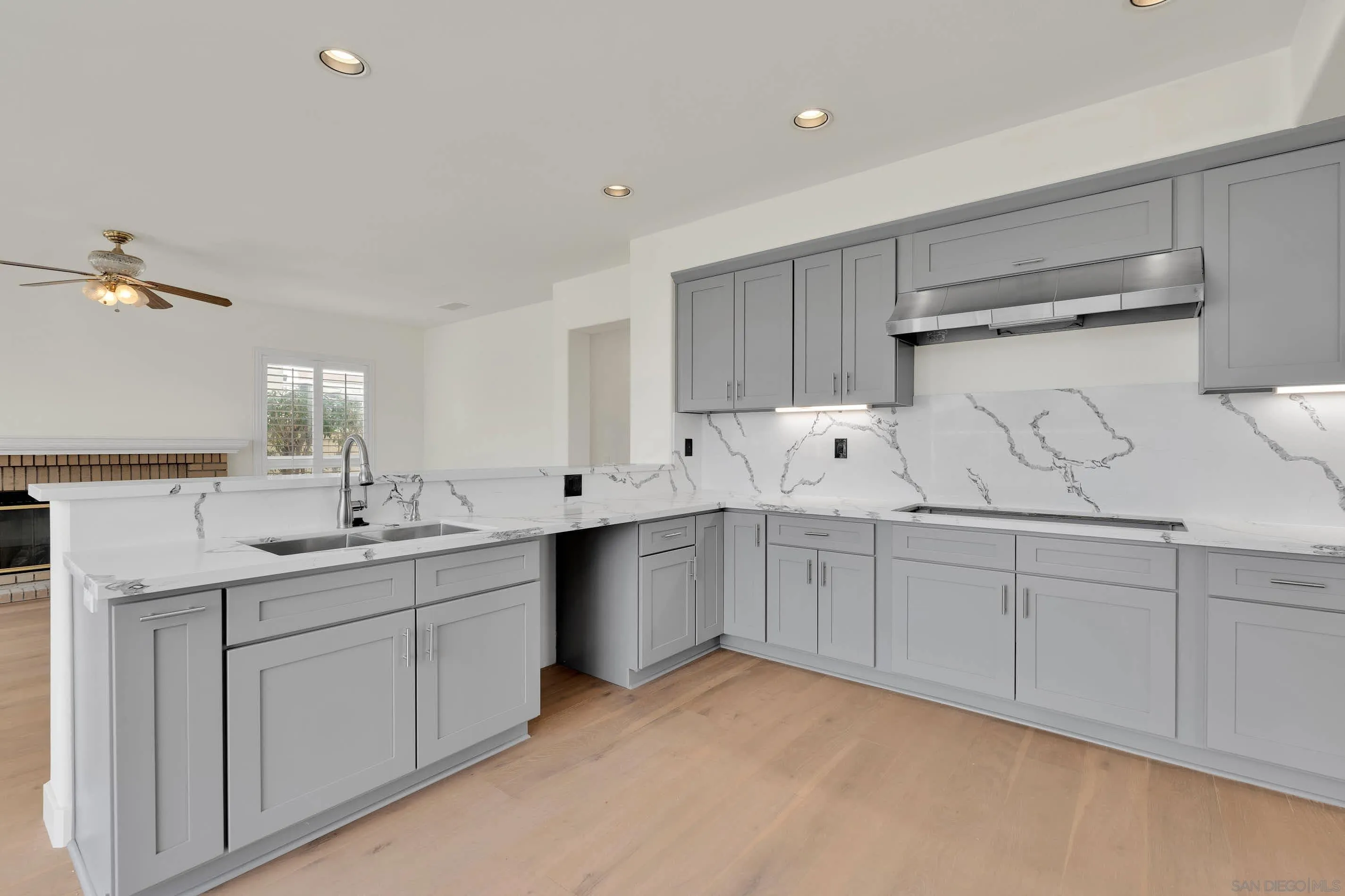 45441 Camino Monzon Temecula, CA 92592 - Photo 13 of 53 a kitchen with sink stove and cabinets