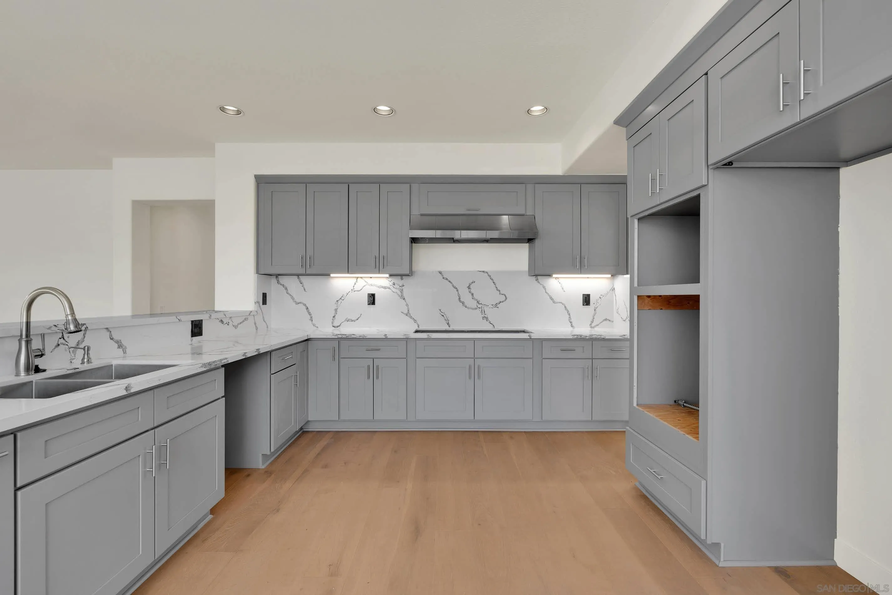 45441 Camino Monzon Temecula, CA 92592 - Photo 14 of 53 a kitchen with cabinets and window