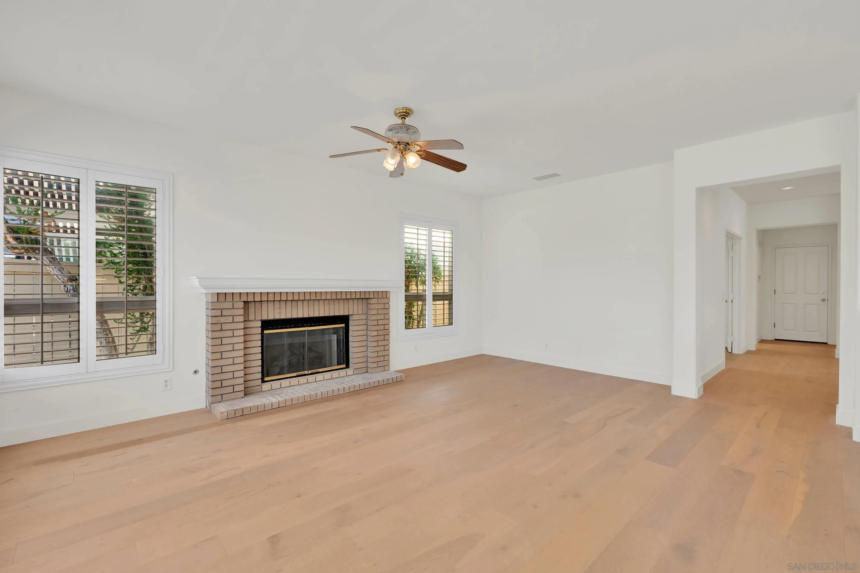 45441 Camino Monzon Temecula, CA 92592 - Photo 18 of 53 a view of an empty room with a fireplace and a window