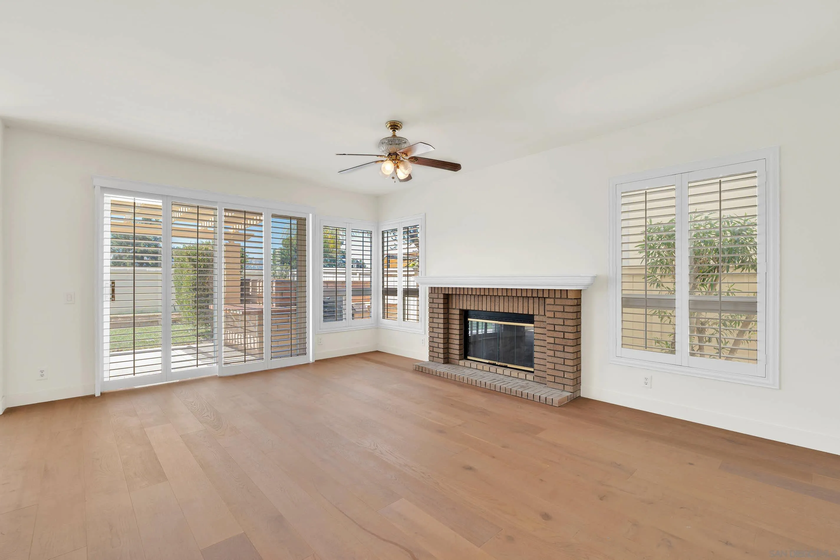45441 Camino Monzon Temecula, CA 92592 - Photo 19 of 53 a view of an empty room with a fireplace and a window