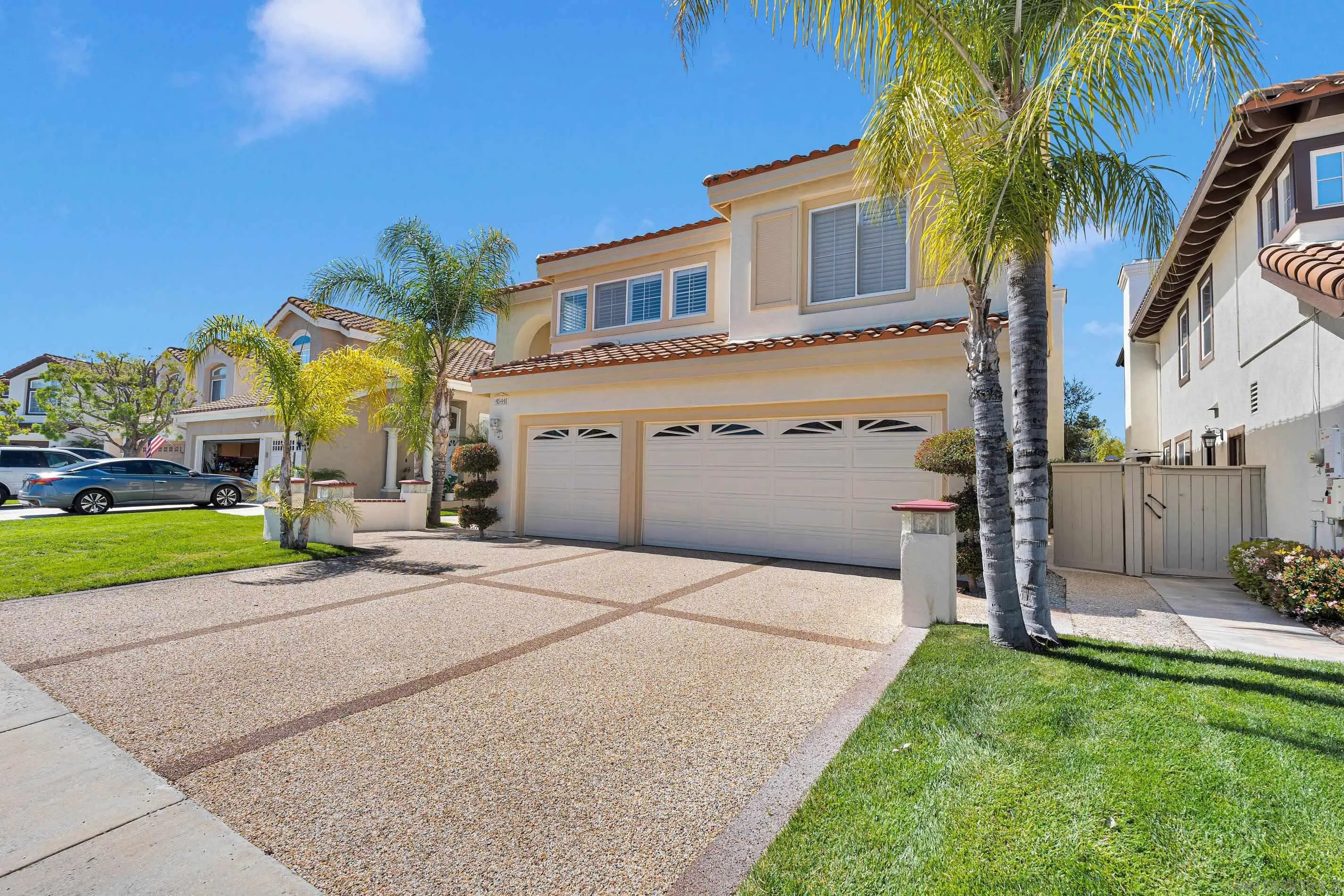 45441 Camino Monzon Temecula, CA 92592 - Photo 2 of 53 a view of a house with a yard and palm trees