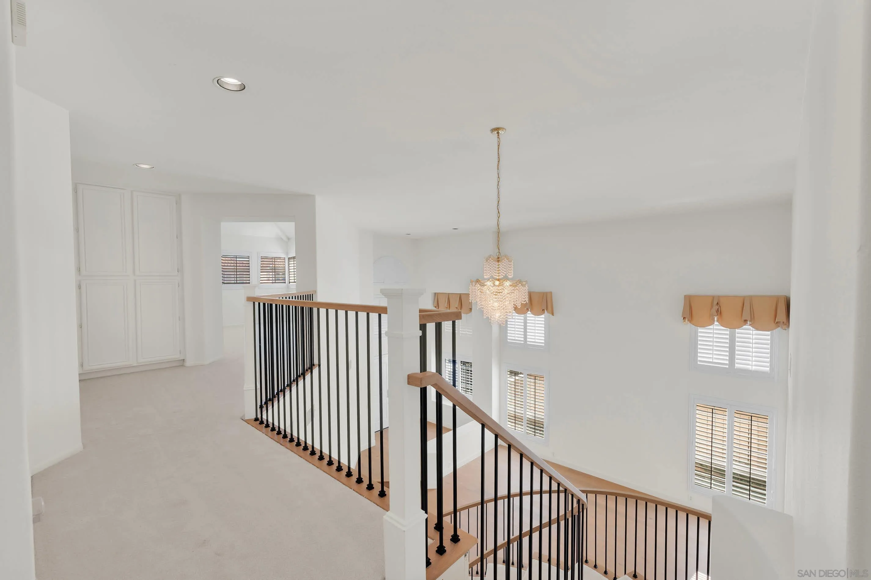 45441 Camino Monzon Temecula, CA 92592 - Photo 21 of 53 a view of a hallway with windows