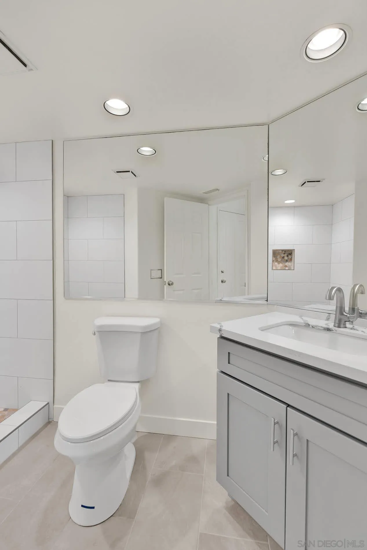 45441 Camino Monzon Temecula, CA 92592 - Photo 23 of 53 a bathroom with a toilet a sink and mirror