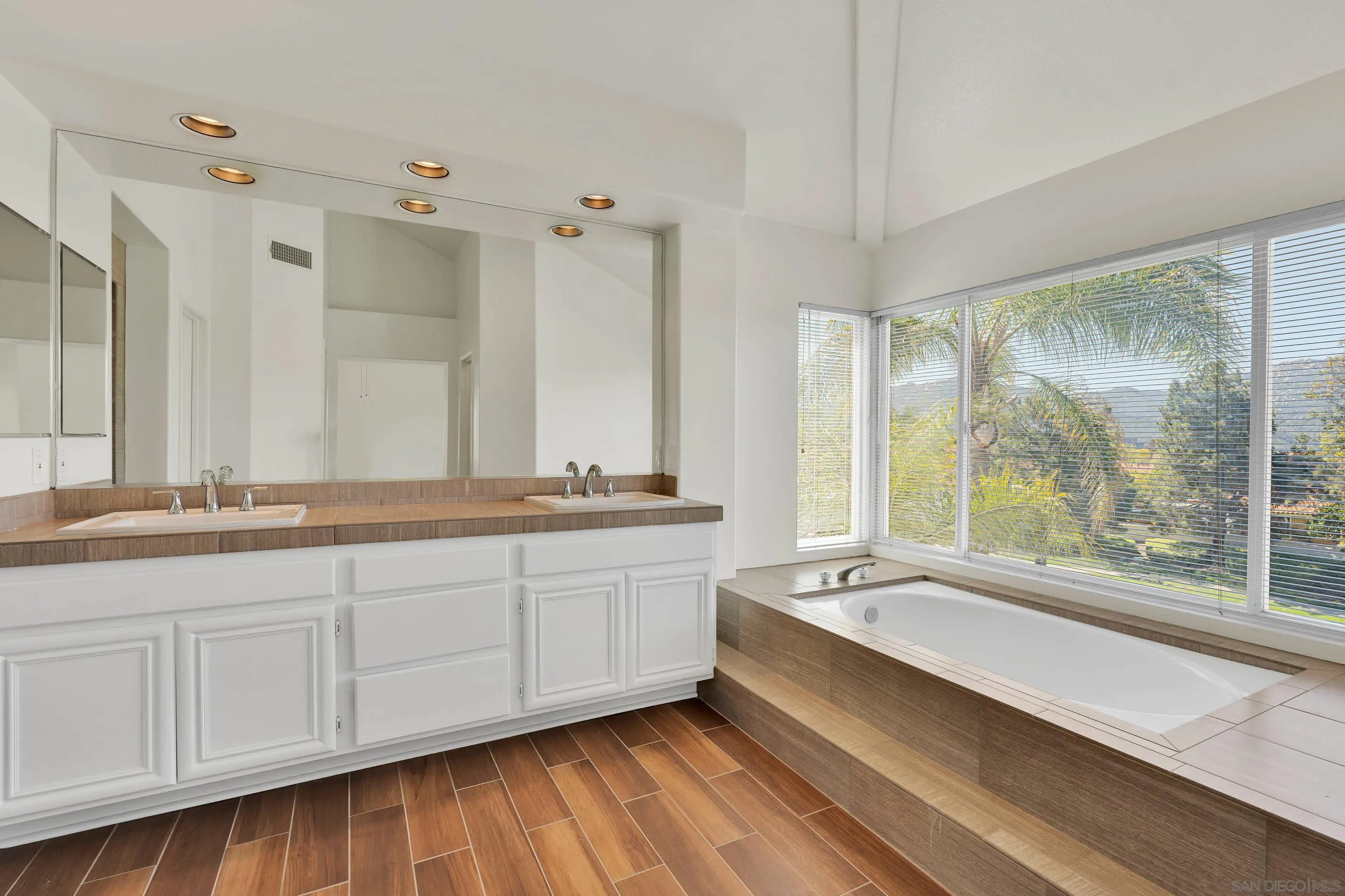 45441 Camino Monzon Temecula, CA 92592 - Photo 36 of 53 a bathroom with double vanity and a large mirror