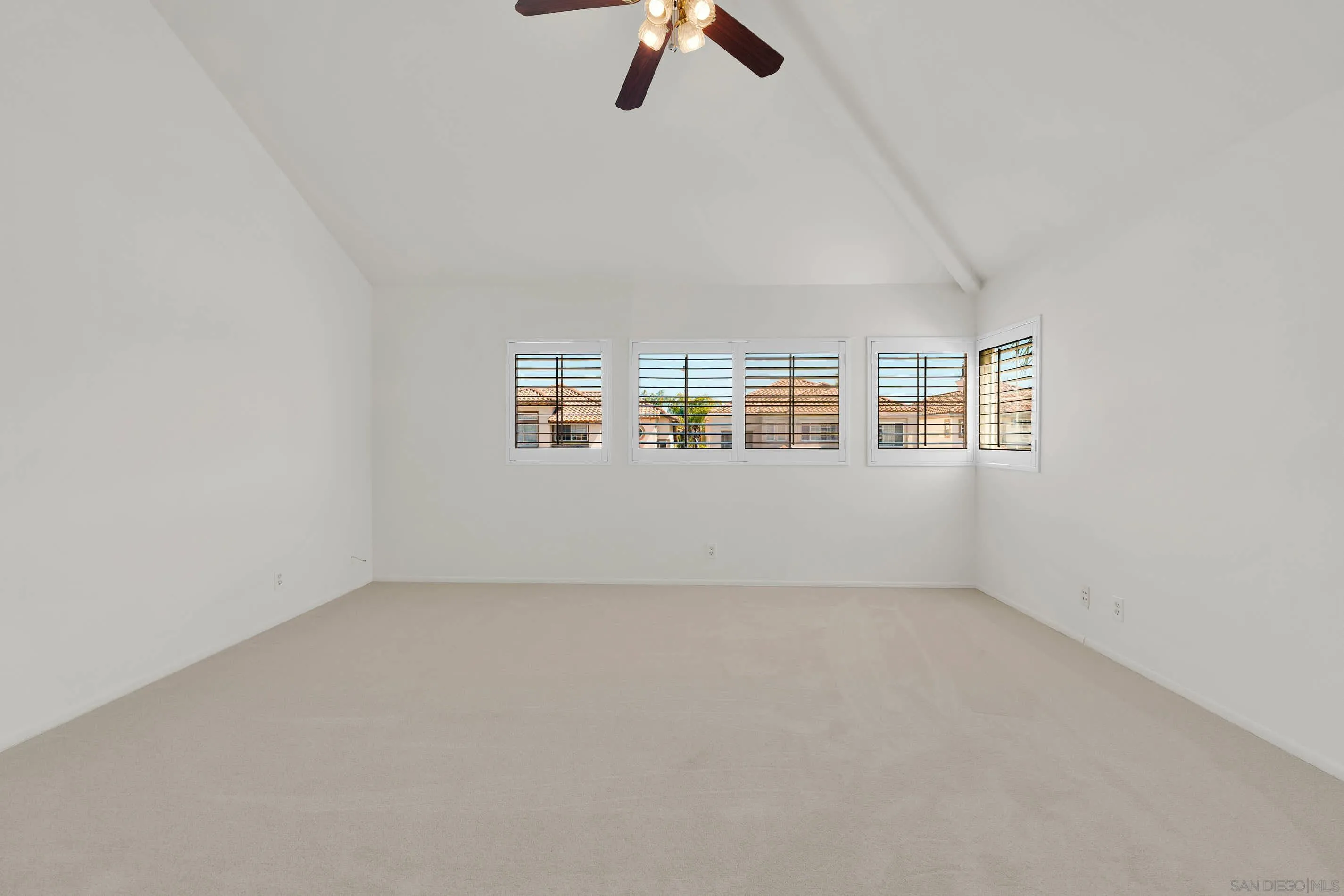 45441 Camino Monzon Temecula, CA 92592 - Photo 40 of 53 an empty room with chandelier fan and windows