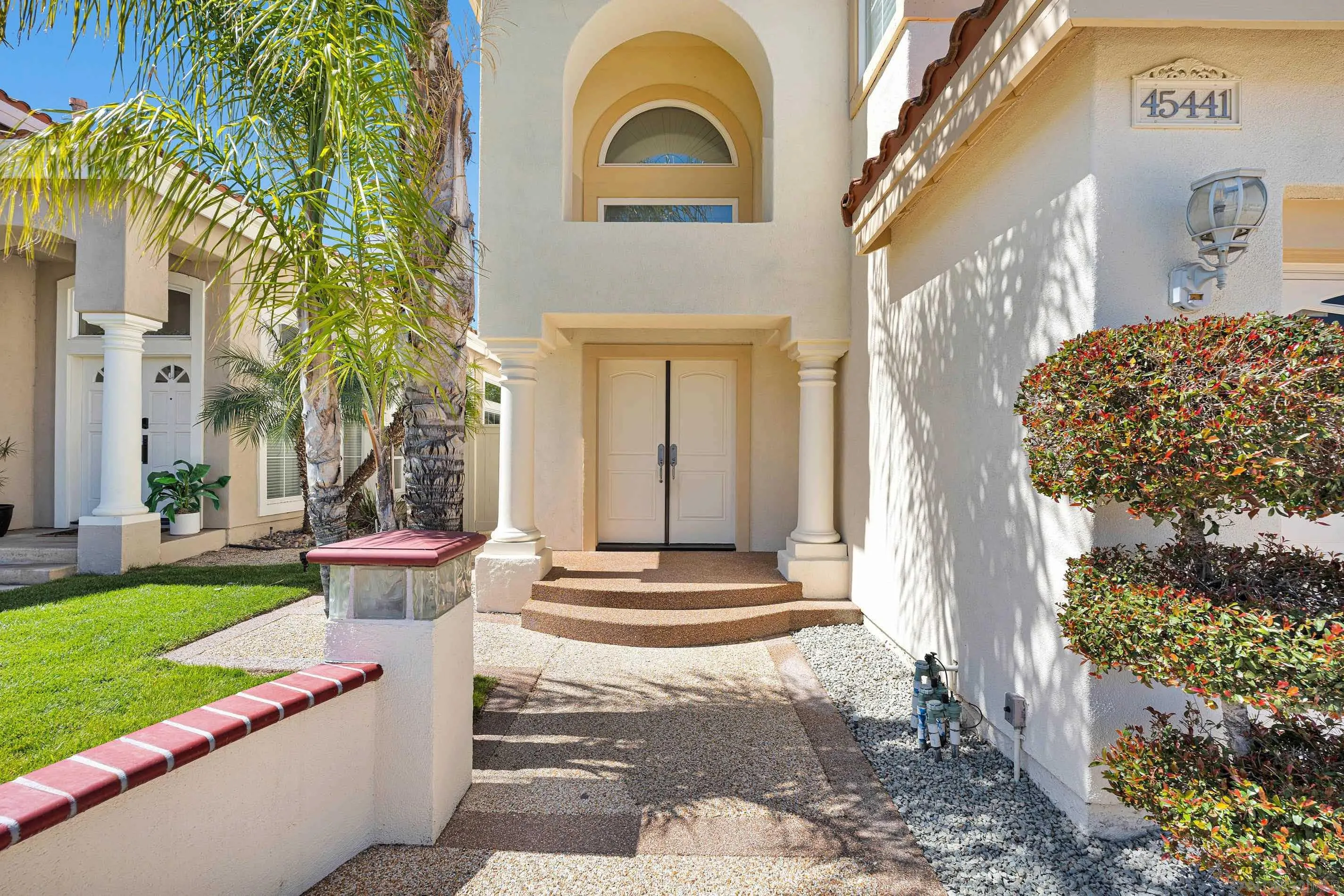 45441 Camino Monzon Temecula, CA 92592 - Photo 4 of 53 a front view of a house with a yard