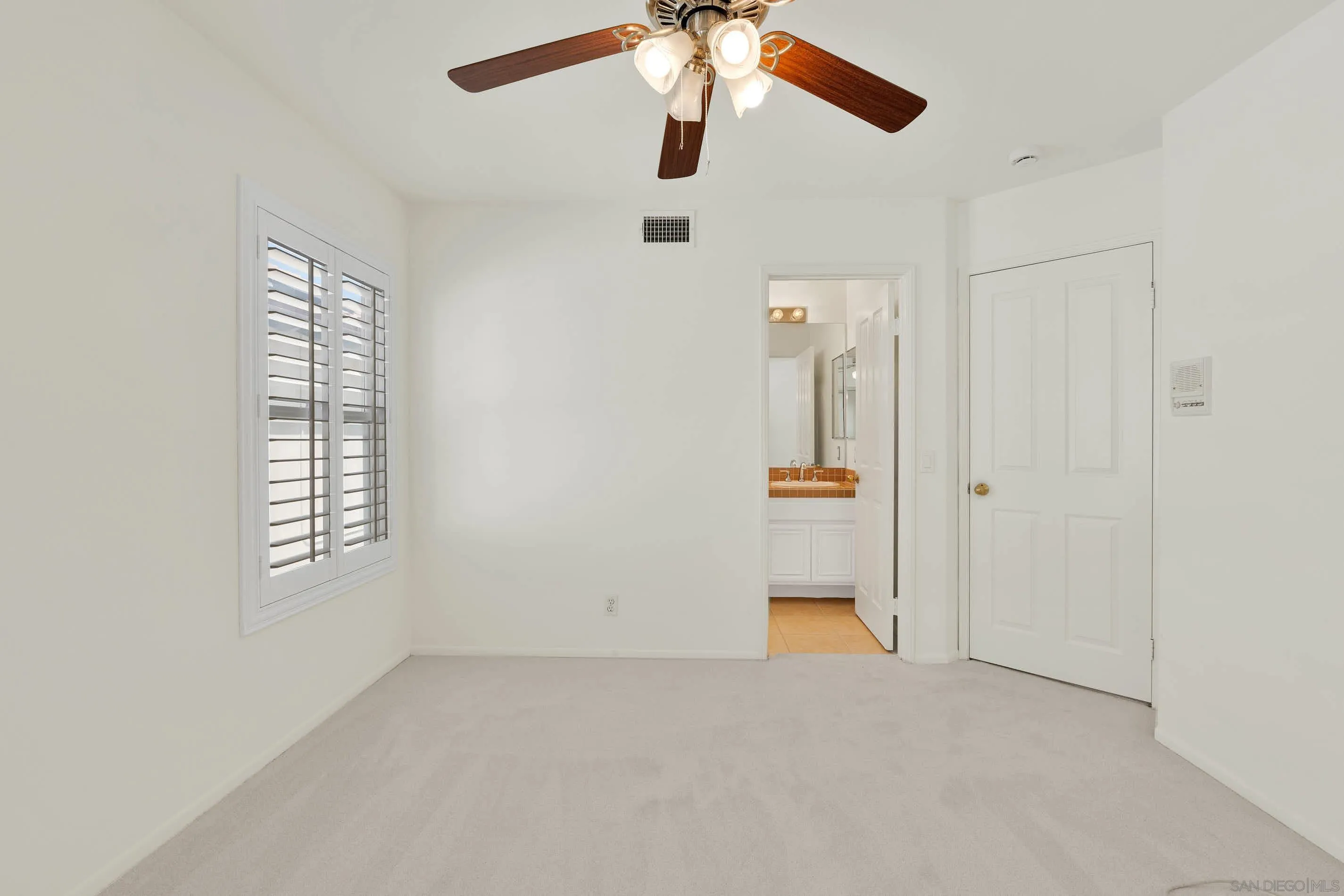45441 Camino Monzon Temecula, CA 92592 - Photo 43 of 53 an empty room with chandelier fan and windows