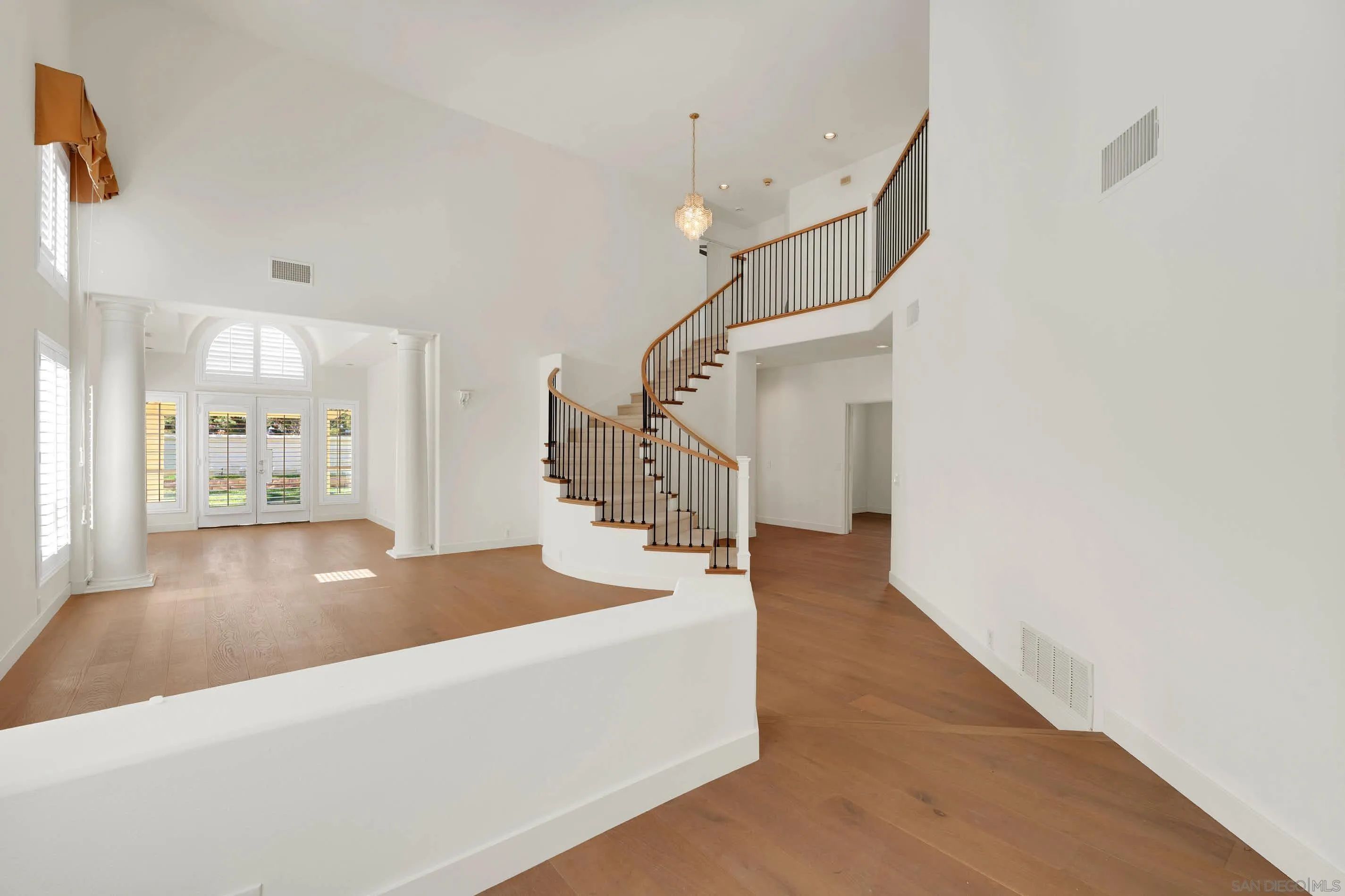 45441 Camino Monzon Temecula, CA 92592 - Photo 5 of 53 a view of a hallway with wooden floor and staircase