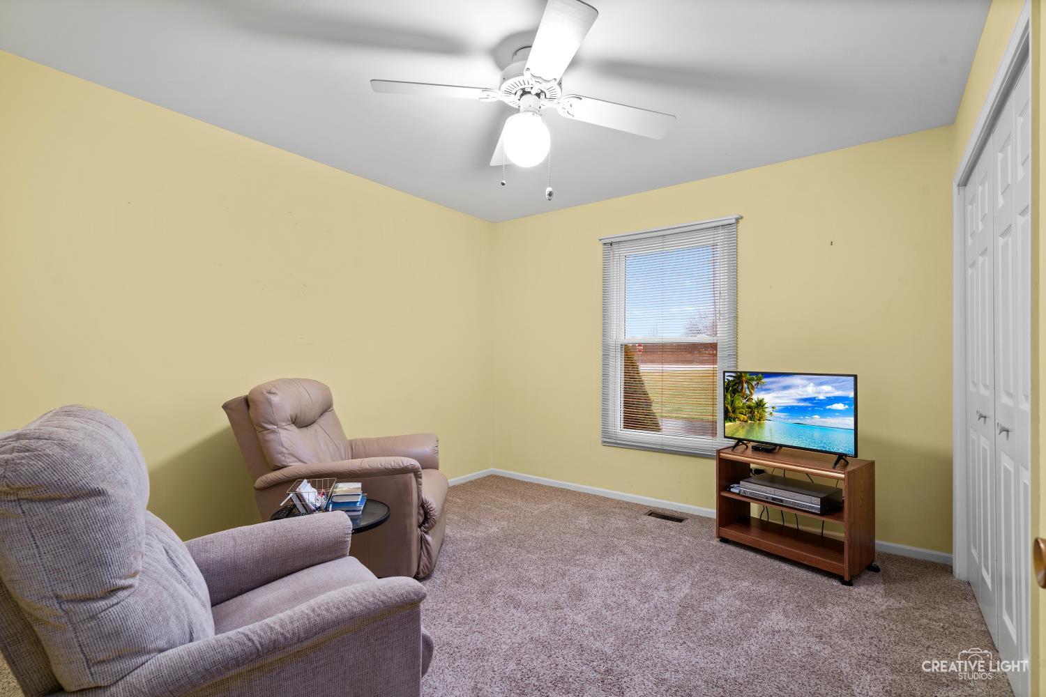 11N638 Old Barn Road Elgin, IL 60124 - Photo 13 of 26 a living room with furniture and a flat screen tv
