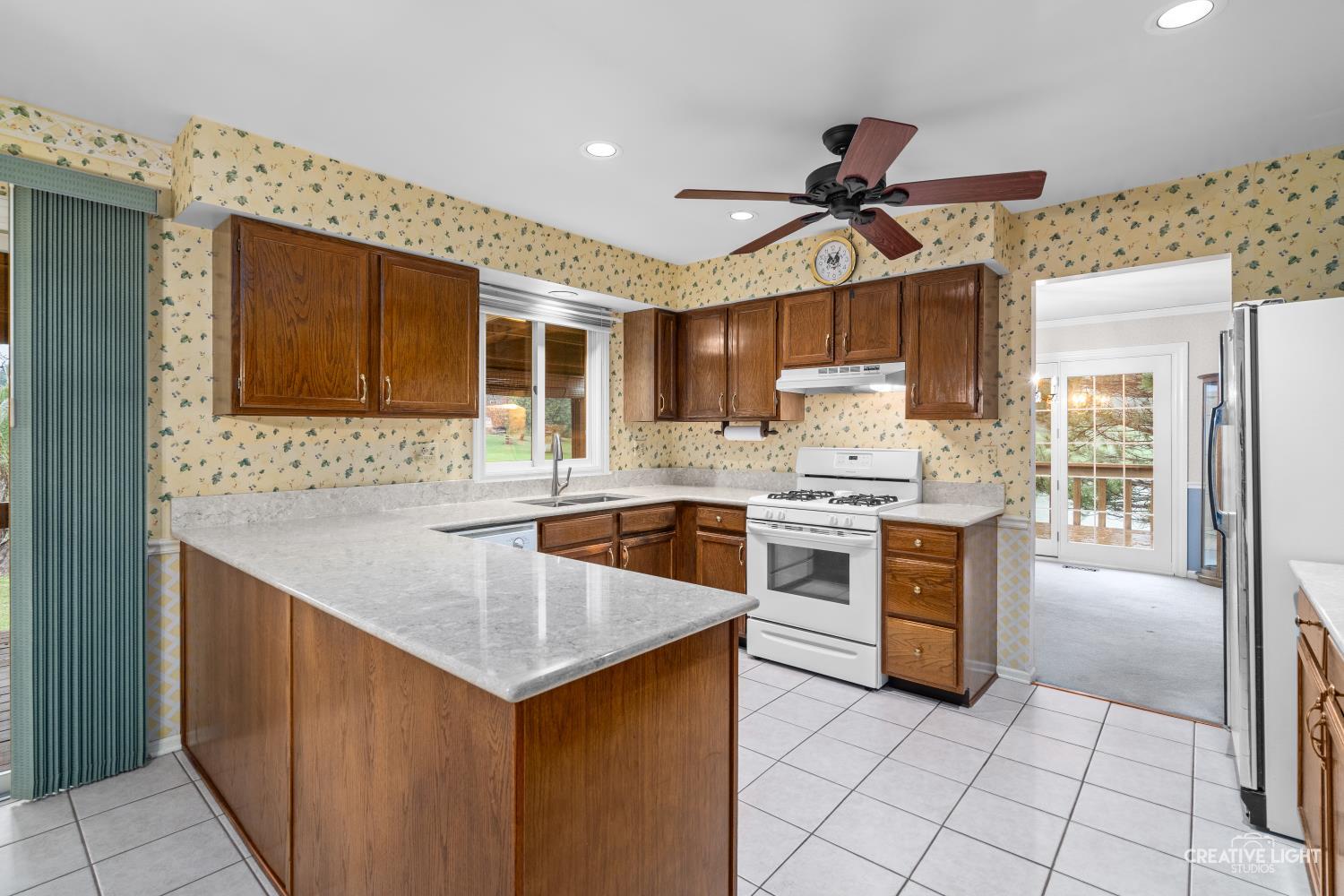 11N638 Old Barn Road Elgin, IL 60124 - Photo 5 of 26 a kitchen with granite countertop a sink and cabinets