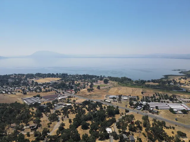 an aerial view of house with yard