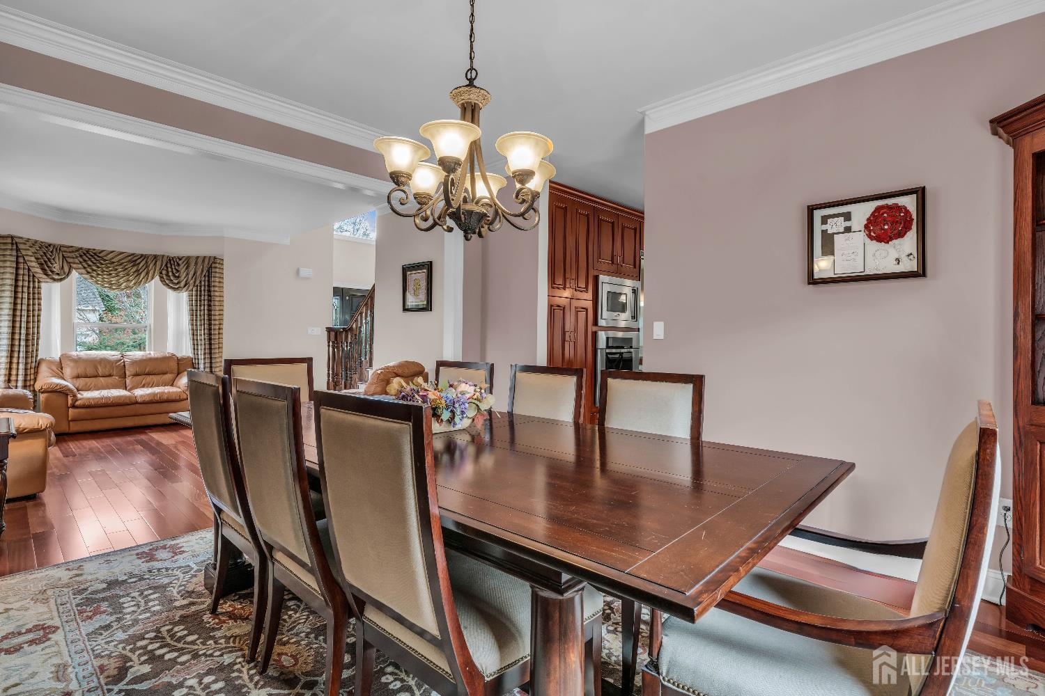 26 Cannon Road Old Bridge, NJ 08857 - Photo 15 of 39 a view of a dining room with furniture a chandelier and wooden floor