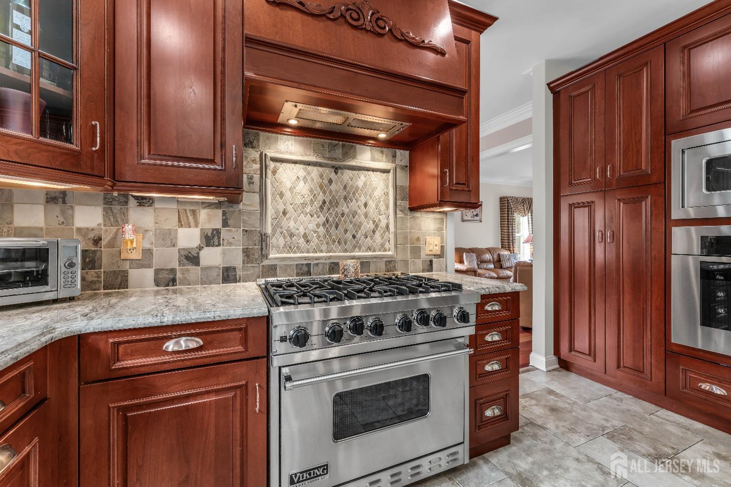 26 Cannon Road Old Bridge, NJ 08857 - Photo 20 of 39 a kitchen with stainless steel appliances granite countertop a stove and a sink