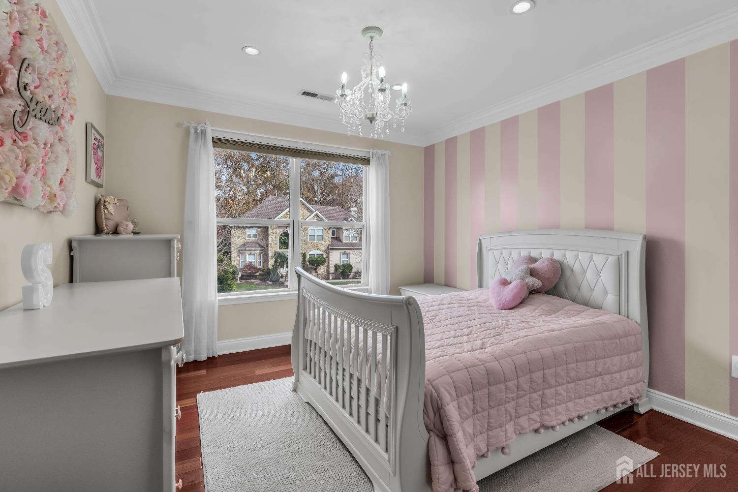 26 Cannon Road Old Bridge, NJ 08857 - Photo 26 of 39 a bedroom with a bed and a chandelier