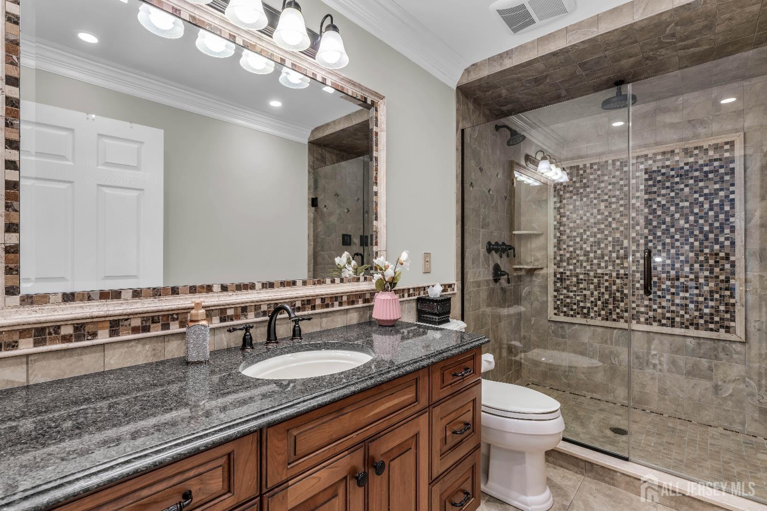 26 Cannon Road Old Bridge, NJ 08857 - Photo 28 of 39 a bathroom with a granite countertop double vanity sink mirror and toilet