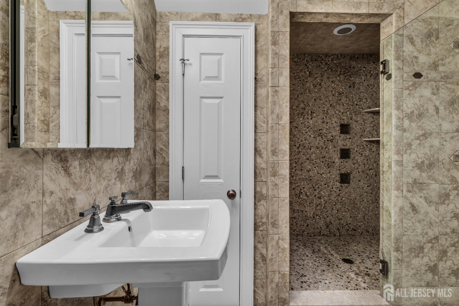 26 Cannon Road Old Bridge, NJ 08857 - Photo 38 of 39 a bathroom with a sink a mirror and shower