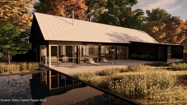 a view of house with outdoor space and sitting area