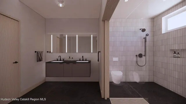 a bathroom with a granite countertop sink a mirror and a shower
