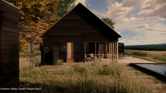 a view of a house with backyard porch and furniture