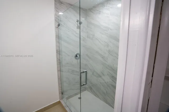 a white toilet sitting next to a bathroom sink