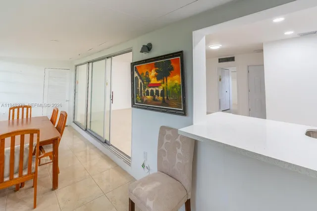 a view of a hallway with furniture and front door