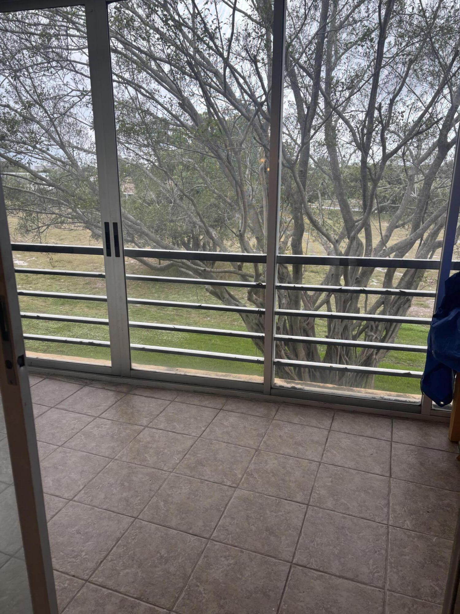 6461 Northwest 2nd Avenue, Unit 313 Boca Raton, FL 33487 - Photo 8 of 9 a view of outdoor space with deck