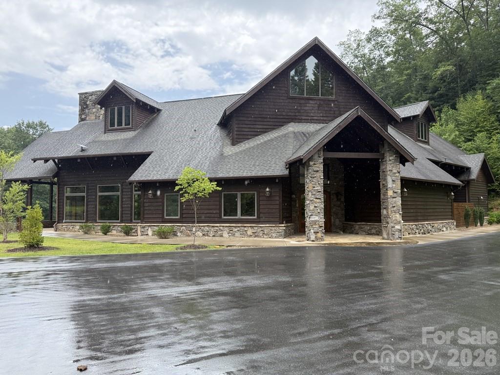 Lot 6 Garnet Road Sylva, NC 28779 - Photo 5 of 9 a front view of a house with a yard