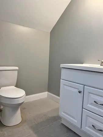 a bathroom with a toilet and a sink