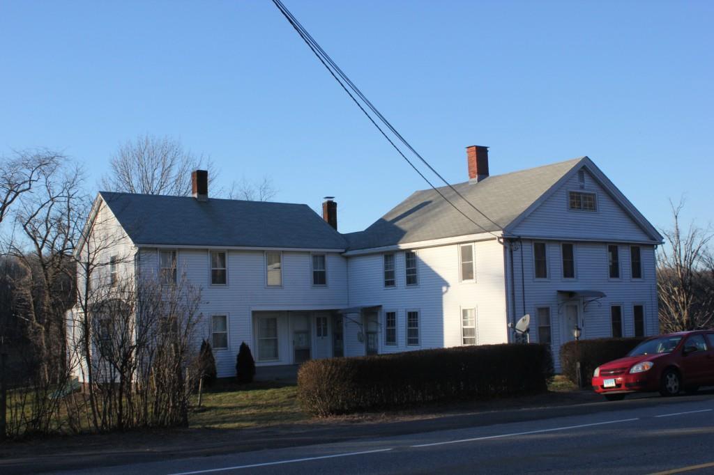 a front view of a house with trees