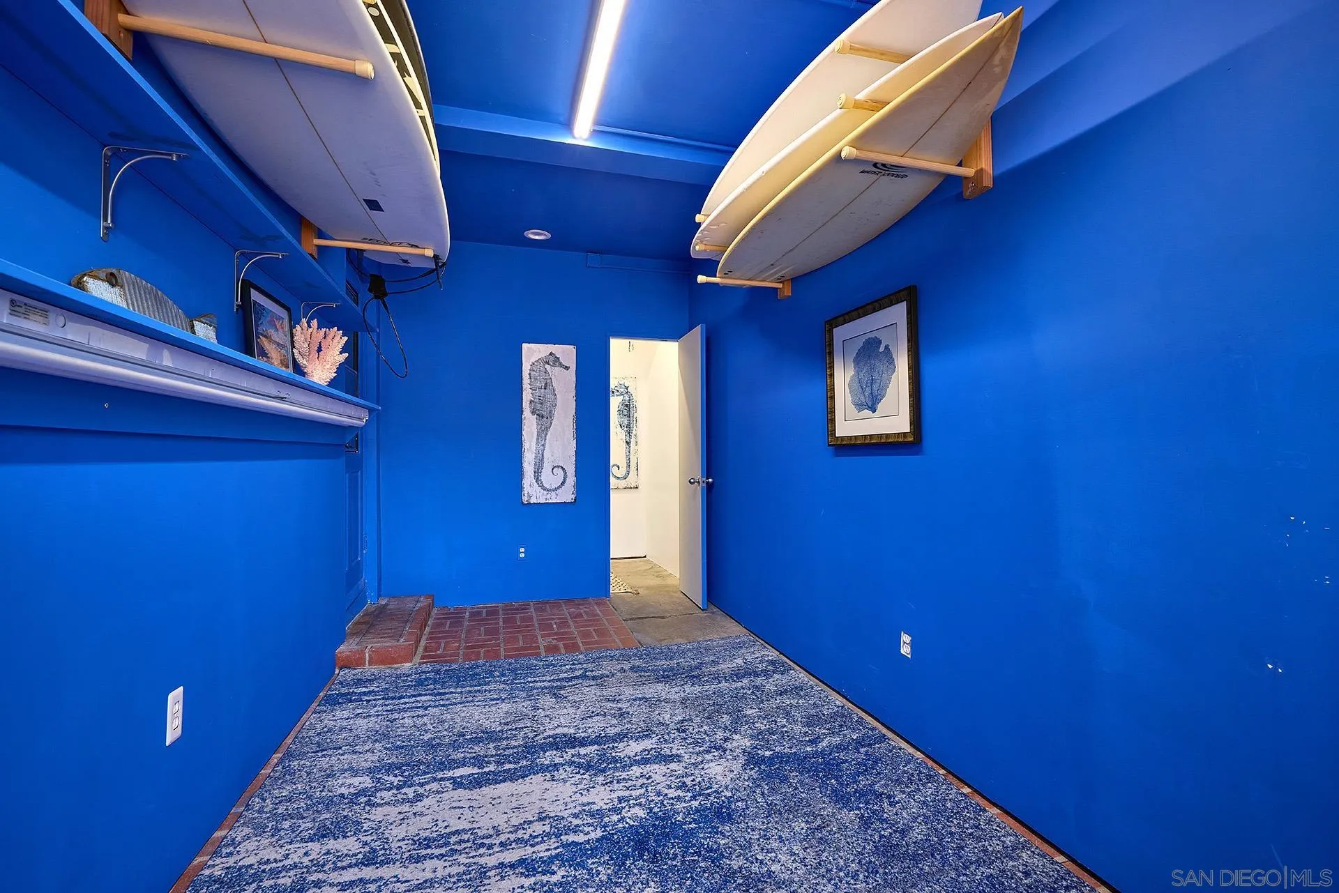 211 La Mesa Avenue Encinitas, CA 92024 - Photo 35 of 53 a view of a livingroom with a chair and a bookshelf