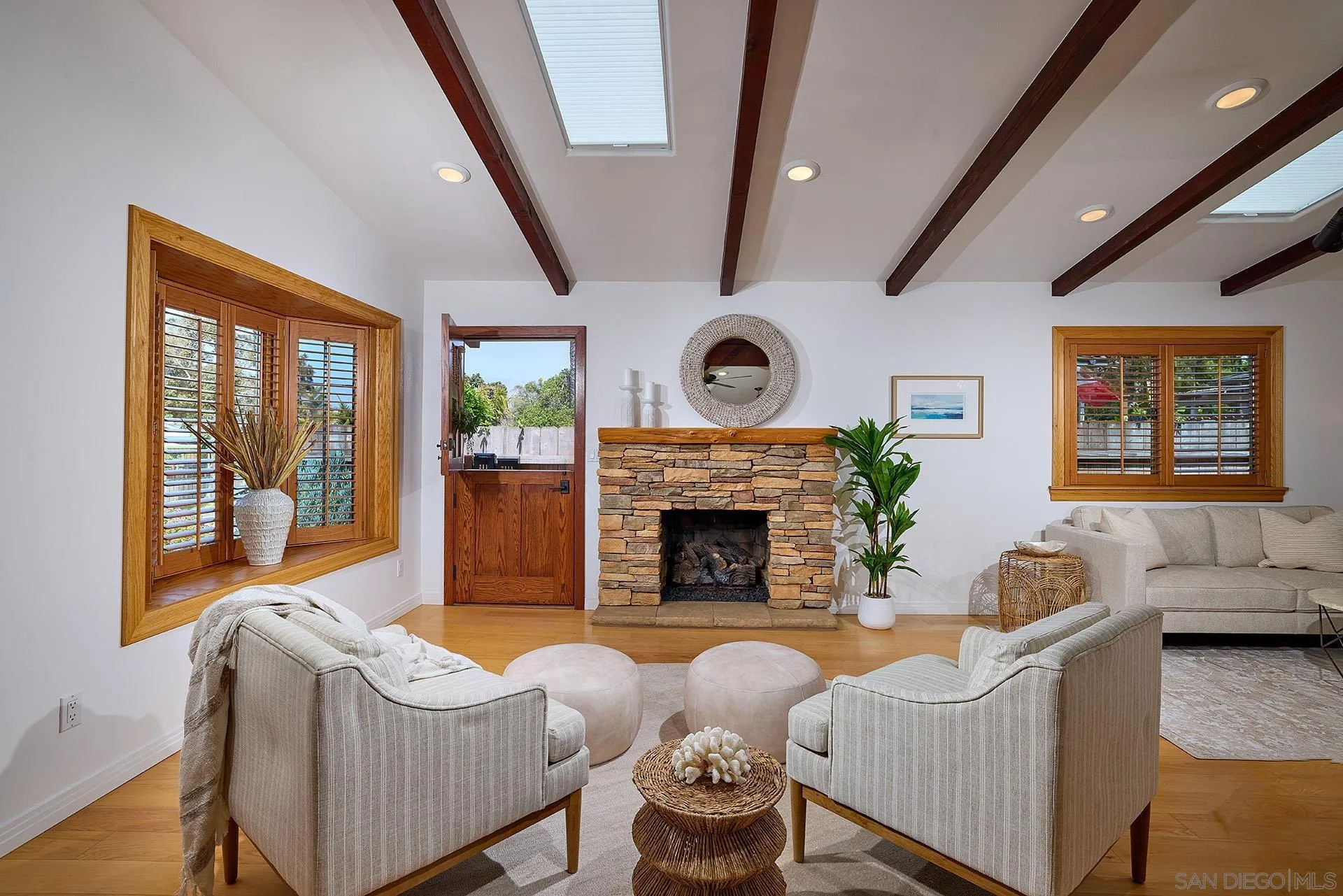 211 La Mesa Avenue Encinitas, CA 92024 - Photo 4 of 53 a living room with furniture and a fireplace