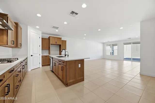 a view of kitchen and refrigerator
