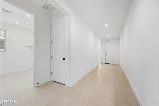 a view of a hallway with closet