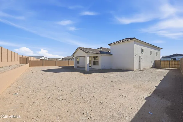 an aerial view of a house with a garden