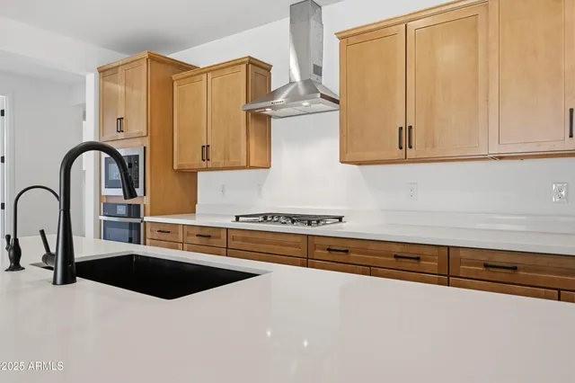a view of a room with a ceiling fan